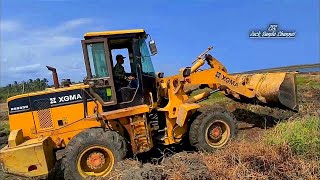 Dredging out the grassy land with a loader to cover the sunken land [upl. by Nama544]