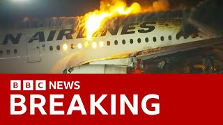 Japan Airlines plane in flames on the runway at Tokyos Haneda Airport BBC News [upl. by Neerbas]