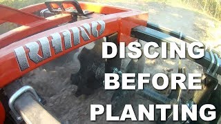 Using a Disc Harrow Discing a field [upl. by Ettelra]