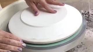 Using the pottery wheel to throw dinner plates on plaster forms [upl. by Shanahan]