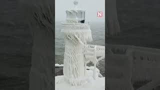 Winter Storm Covers Historic Lake Michigan Lighthouse In Ice [upl. by Eiuqcaj]