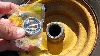 HOW TO REPLACE INSTALL WHEEL BEARINGS RIDING LAWNMOWER JOHN DEERE [upl. by Reinnej]