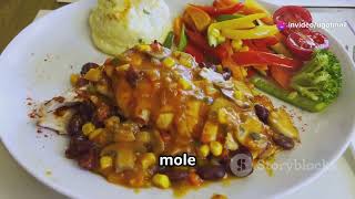 Mole Poblano A complex sauce made with chocolate chili peppers nuts served over chicken or turkey [upl. by Esir]