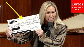 BREAKING NEWS Marjorie Taylor Greene Reveals Giant Copy Of NewlyDiscovered 200000 Check To Biden [upl. by Obed368]