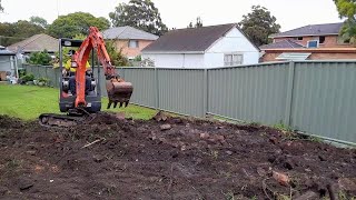 Mini Excavator excavating levelling and reshaping the yard [upl. by Dlaregztif946]