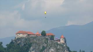 Paraglider soars over Bled Castle [upl. by Analla]