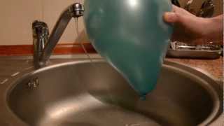 Electric force between the water and the balloon  physics experiment [upl. by Pitt]