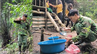 When the man goes into the forest to dig tubers the woman takes care of the child and cleans up [upl. by Meade]