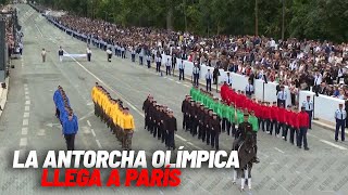 La antorcha olímpica llega a París en el día de la Fiesta Nacional en Francia I MARCA [upl. by Aliel356]