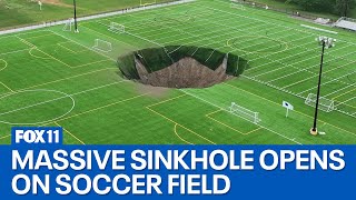 Video captures moment sinkhole opens on soccer field [upl. by Oralee572]