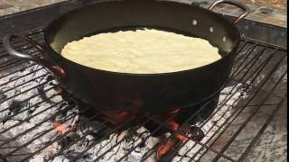 Castiron skillet pizza cooking on the firepit [upl. by Marilin]