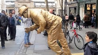 Golden man London street performer floating and levitating trick Covent Gardens [upl. by Evette]