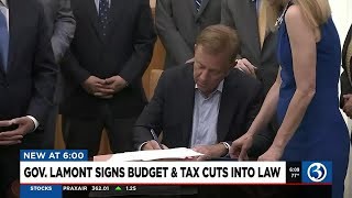 VIDEO Gov Lamont signs budget and tax cuts into law [upl. by Ekyt861]