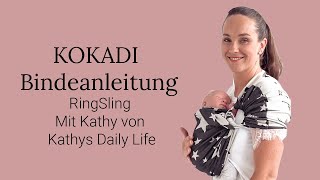 Babytrage Anleitung KOKADI RingSling vorne auf der Brust getragen [upl. by Downes]