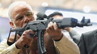 PM Narendra Modi visits DefExpo 2020 tries his hand at Gun [upl. by Errehs]