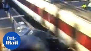 CCTV footage captures moment drunk driver smashes Range Rover into train at level crossing [upl. by Odele]