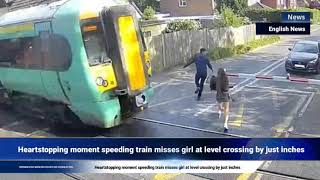 Heartstopping moment speeding train misses girl at level crossing by just inches [upl. by Perni]