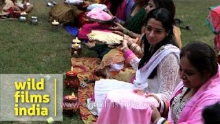 Ladies pass their thalis around in circle  Karva Chauth rituals [upl. by Soisatsana]