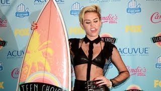 Miley Cyrus Sports A Leather Bra At Teen Choice Awards 2013 [upl. by Raynard]