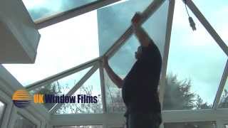 Installing window film on a shaped glass conservatory roof [upl. by Neelie]