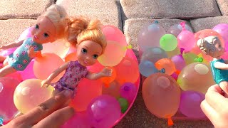 Water balloons Elsa amp Anna toddlers  pool  water fun  floaties [upl. by Leacock]